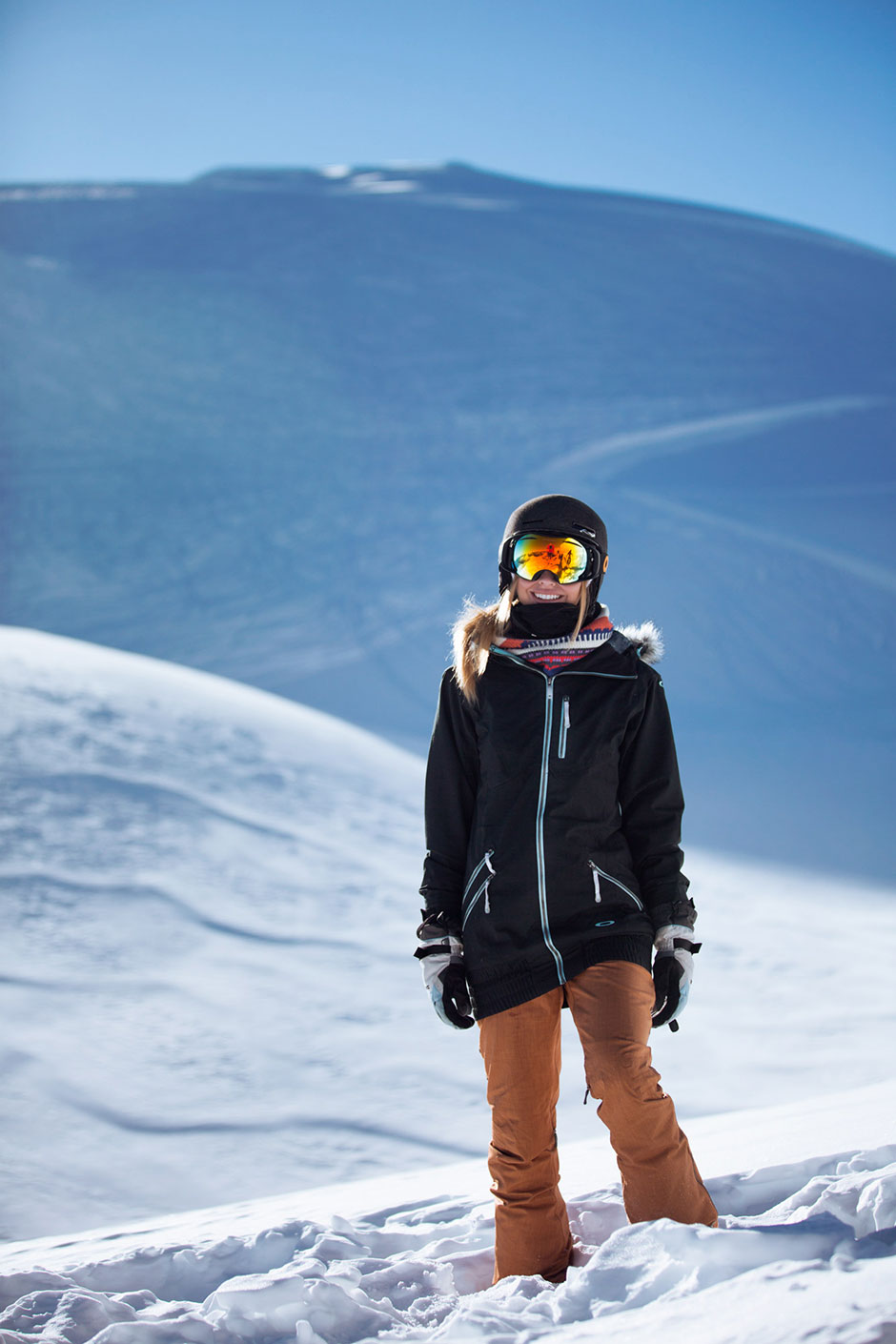 Christine in ski kit on a bluebird mountain day