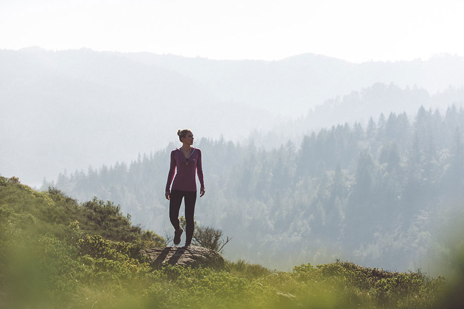 Christine hiking above misty Marin ridgelines